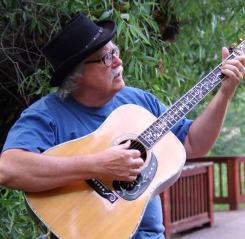 Douglas Lee Saum Playing Guitar